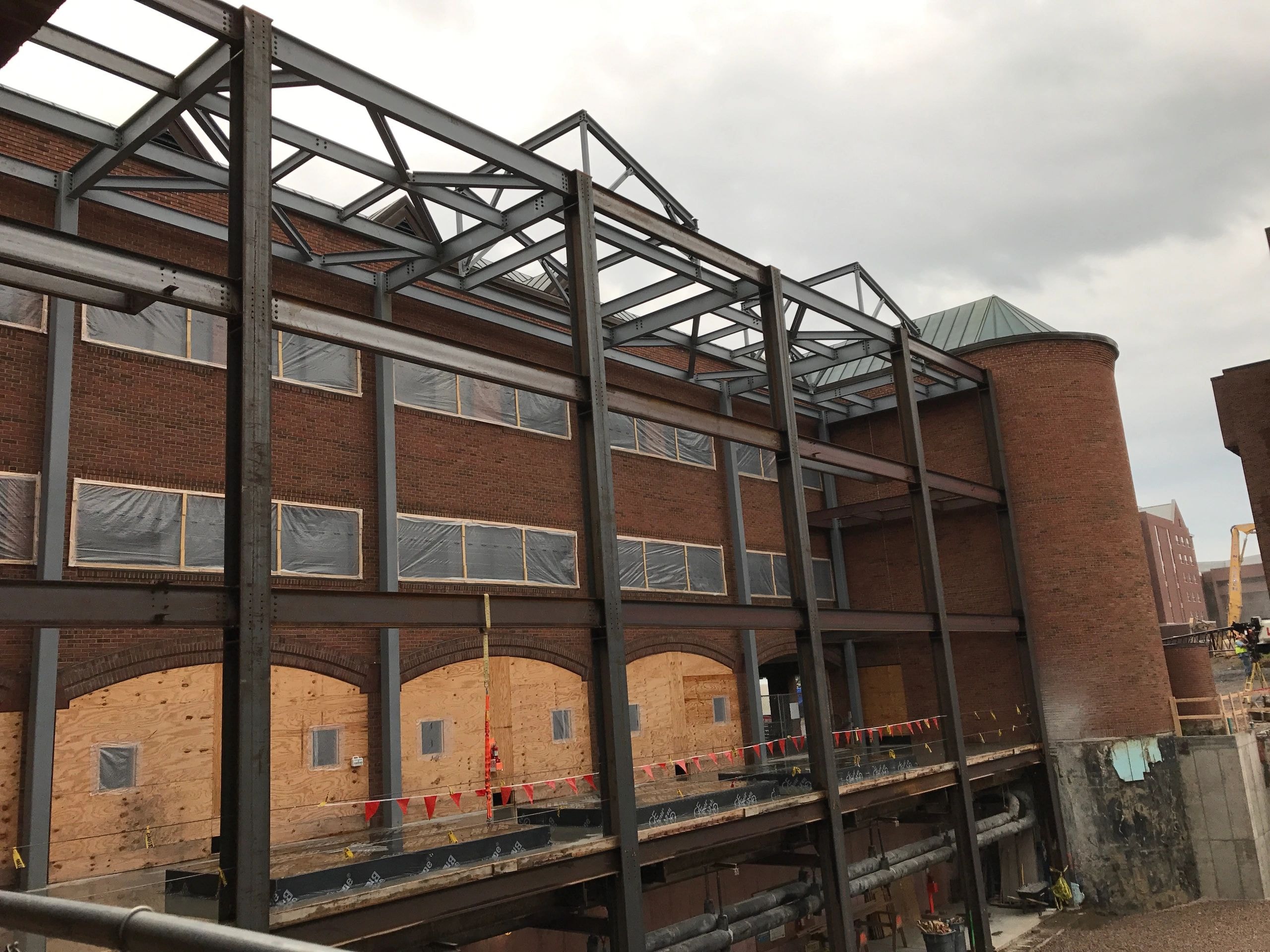 Industrial brick building under renovation with steel framework